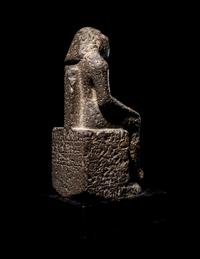 An Egyptian Diorite Seated Figure
