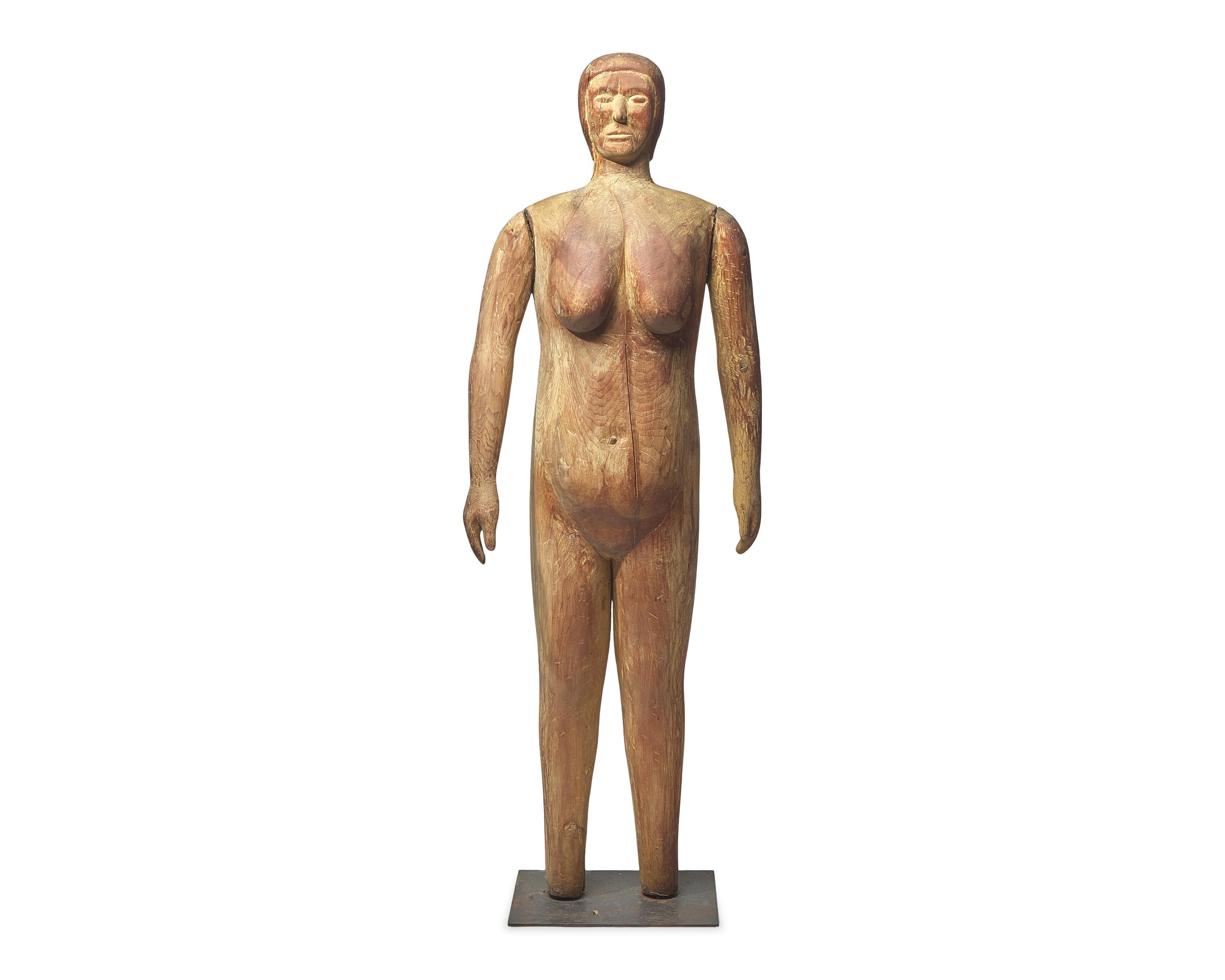 A Life-Size Carved Pine Figure of a Woman