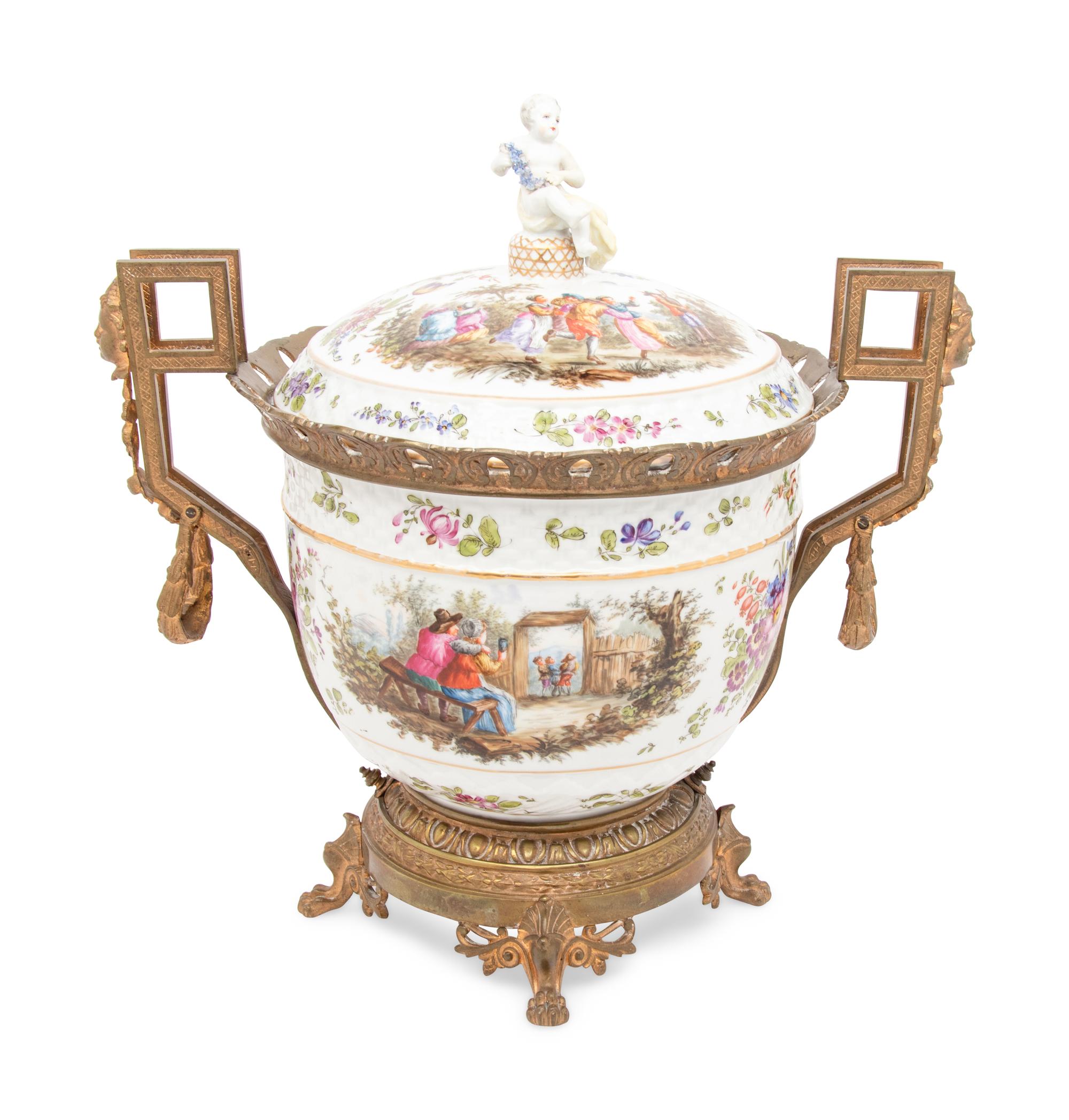 A Continental Gilt Metal Mounted Porcelain Covered Urn