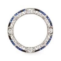 An Edwardian Platinum, Diamond, and Sapphire Circle Brooch, 5.65 dwts.