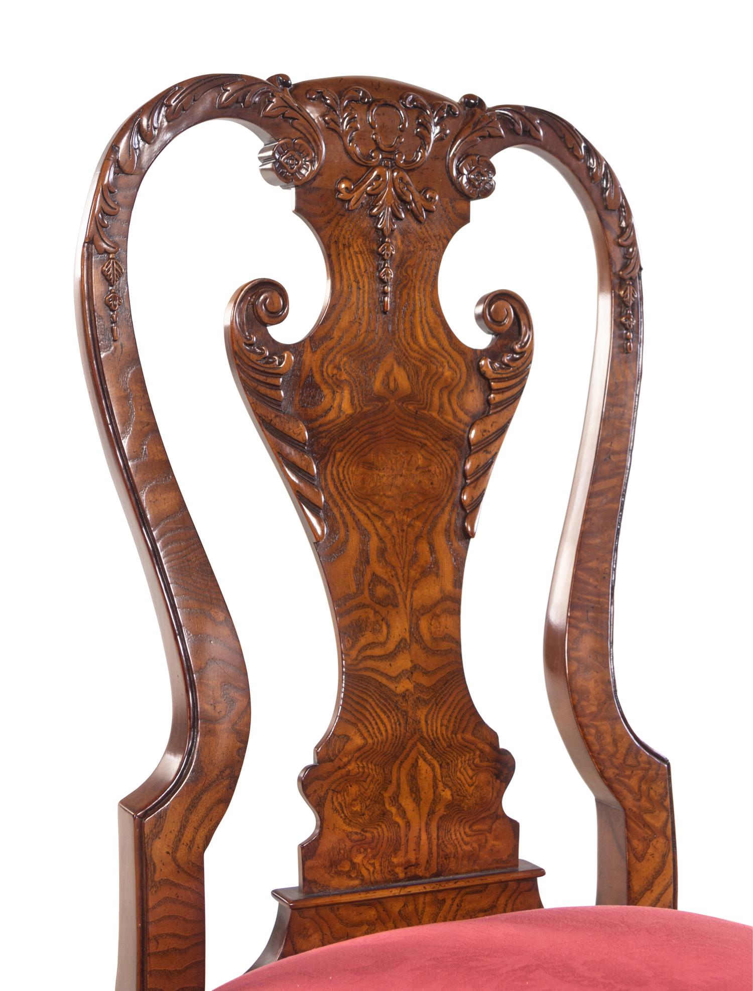 A Set of Twelve Baker George II Style Dining Chairs