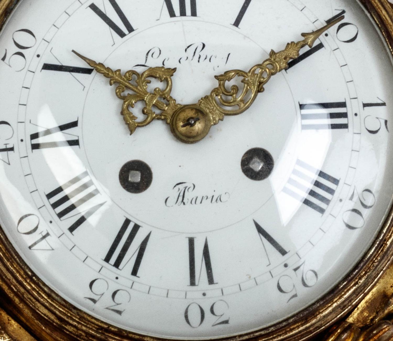 A Louis XVI Style Gilt Bronze Cartel Clock