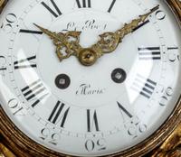 A Louis XVI Style Gilt Bronze Cartel Clock