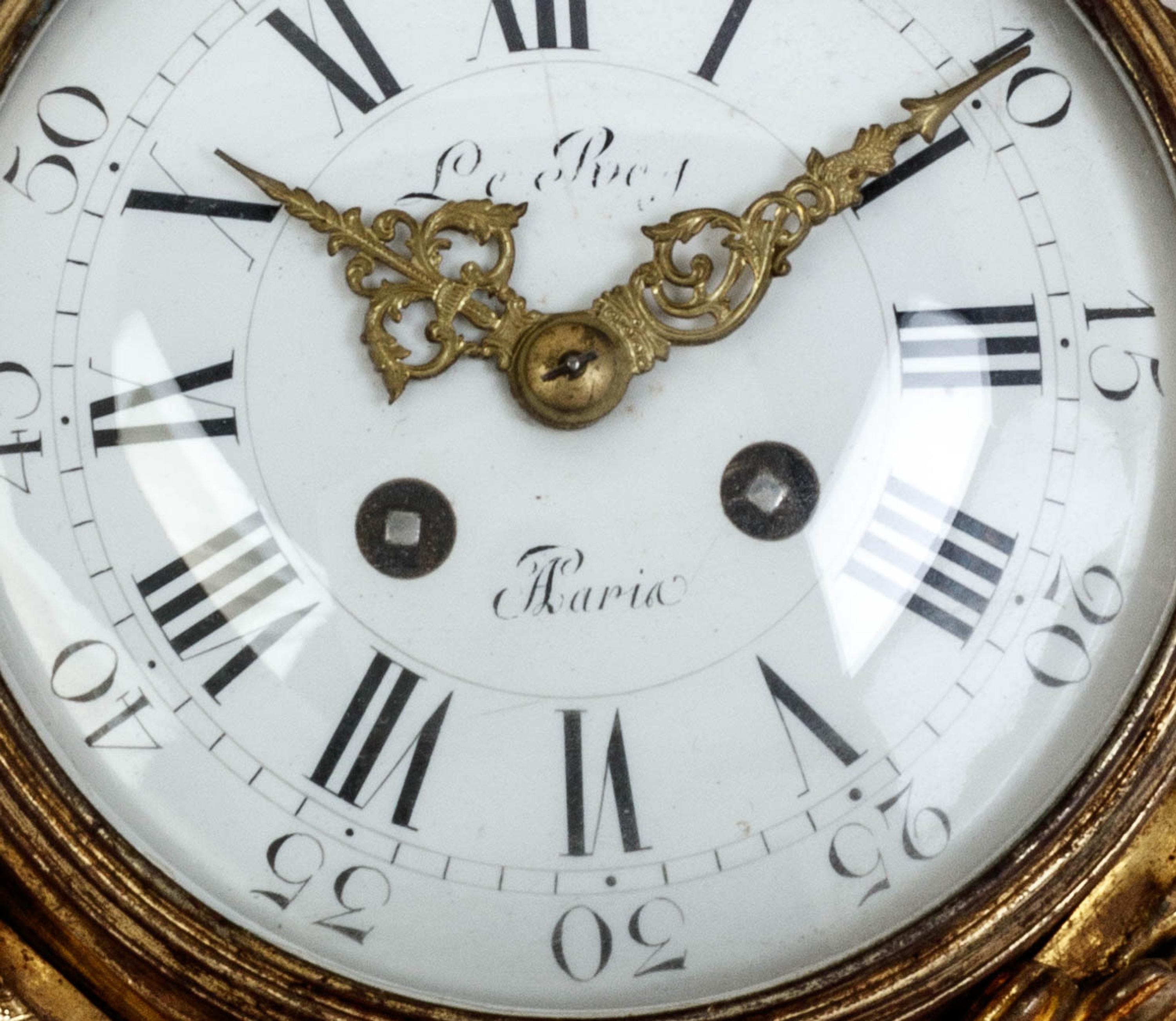 A Louis XVI Style Gilt Bronze Cartel Clock