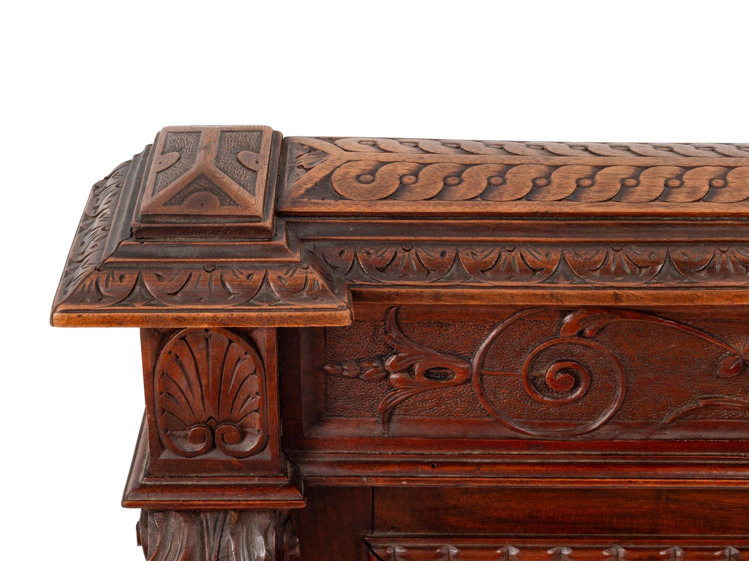 A Pair of Italian Carved Walnut Panels with Marble Profile Plaques