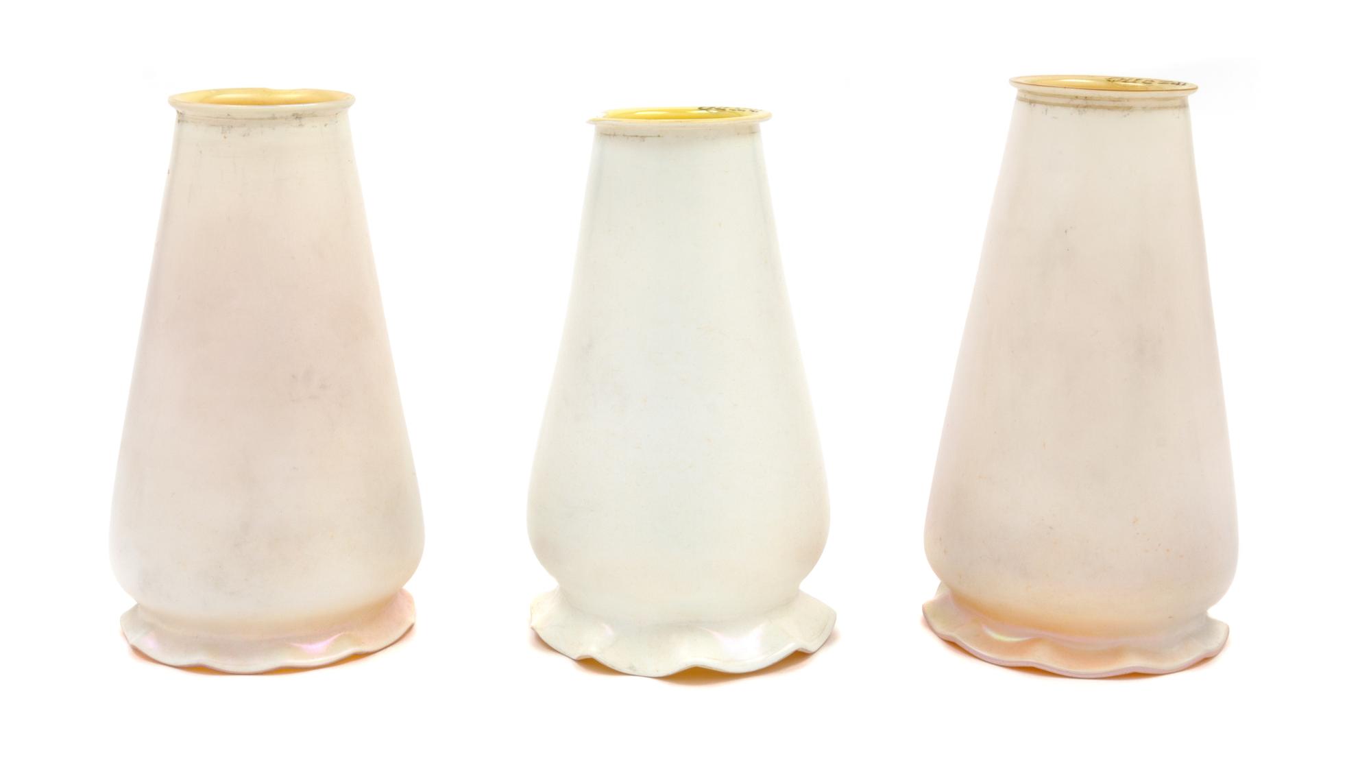 A Set of Three Quezal Glass Shades Height 6 1/2 inches.
