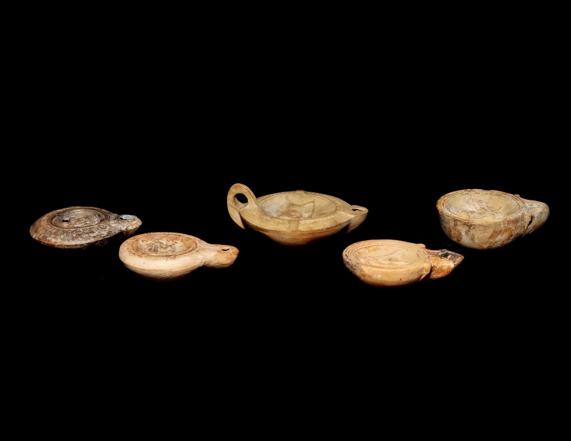 Five Roman Molded Terra Cotta Oil Lamps