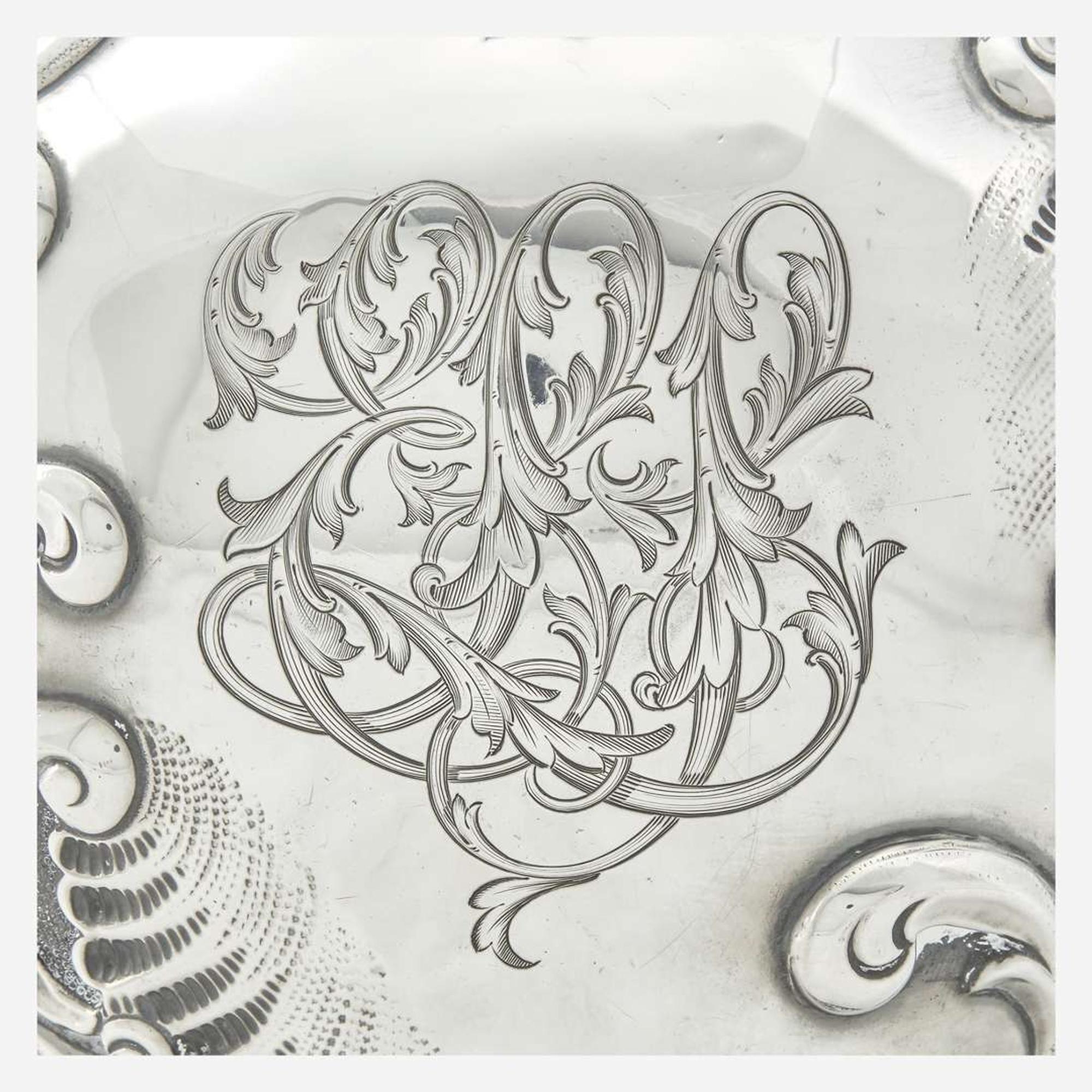 A sterling silver repoussé water pitcher Retailed by Bailey Banks & Biddle, Philadelphia, PA, late 19th century