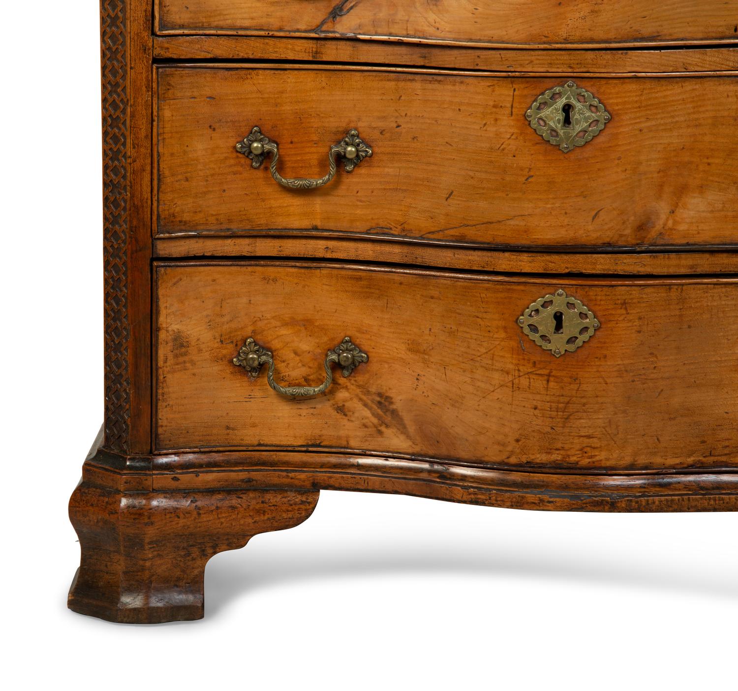 A George III Walnut Serpentine Chest of Drawers — 18TH CENTURY