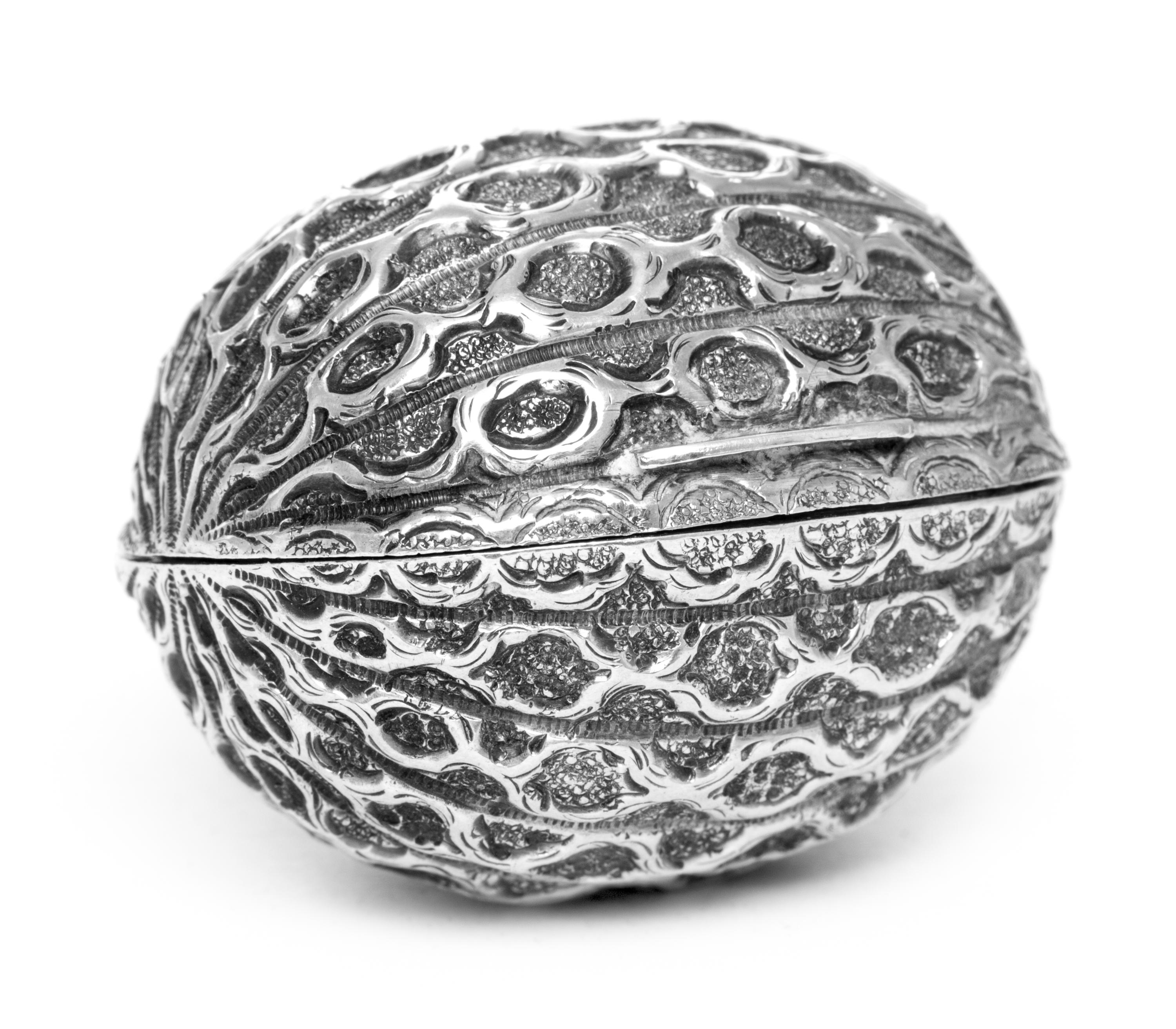 A Victorian Silver Nutmeg Grater, Hillard & Thompson, Birmingham, 1871, in the form of a nutmeg, the hinged case opening to a grater.