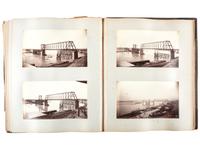 [WESTERN AMERICANA]. Album of photographs showing the construction of the "Bismarck Bridge." [Dakota Territory]: [F. Jay Haynes], [1882].