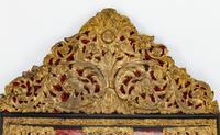 A Flemish Baroque Style Repouséed Brass, Simulated Tortoise and Ebonized Wood Mirror
