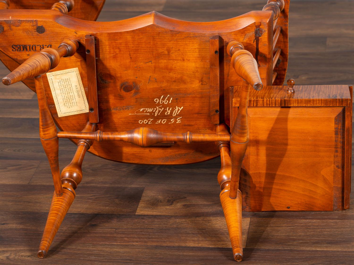 A D.R. Dimes Turned and Volute Carved Tiger Maple Windsor Three-Back Writing Armchair