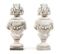 A Pair of Cast Stone Models of Fruit-Filled Urns Height 31 inches. — 20TH CENTURY