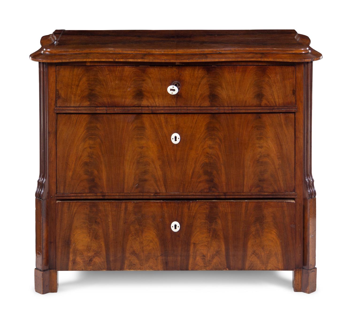 A Continental Mahogany Veneered Chest of Drawers