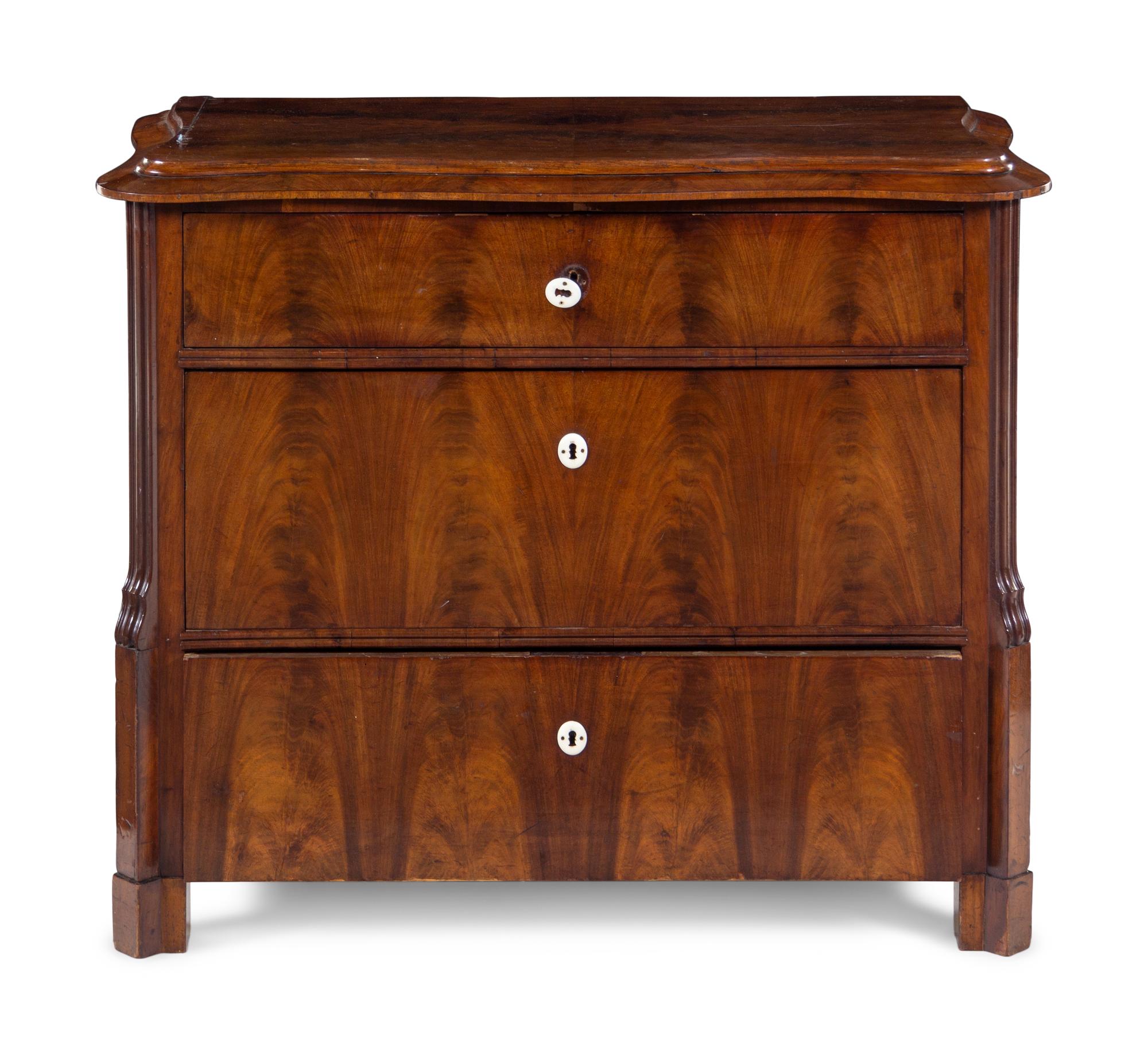 A Continental Mahogany Veneered Chest of Drawers