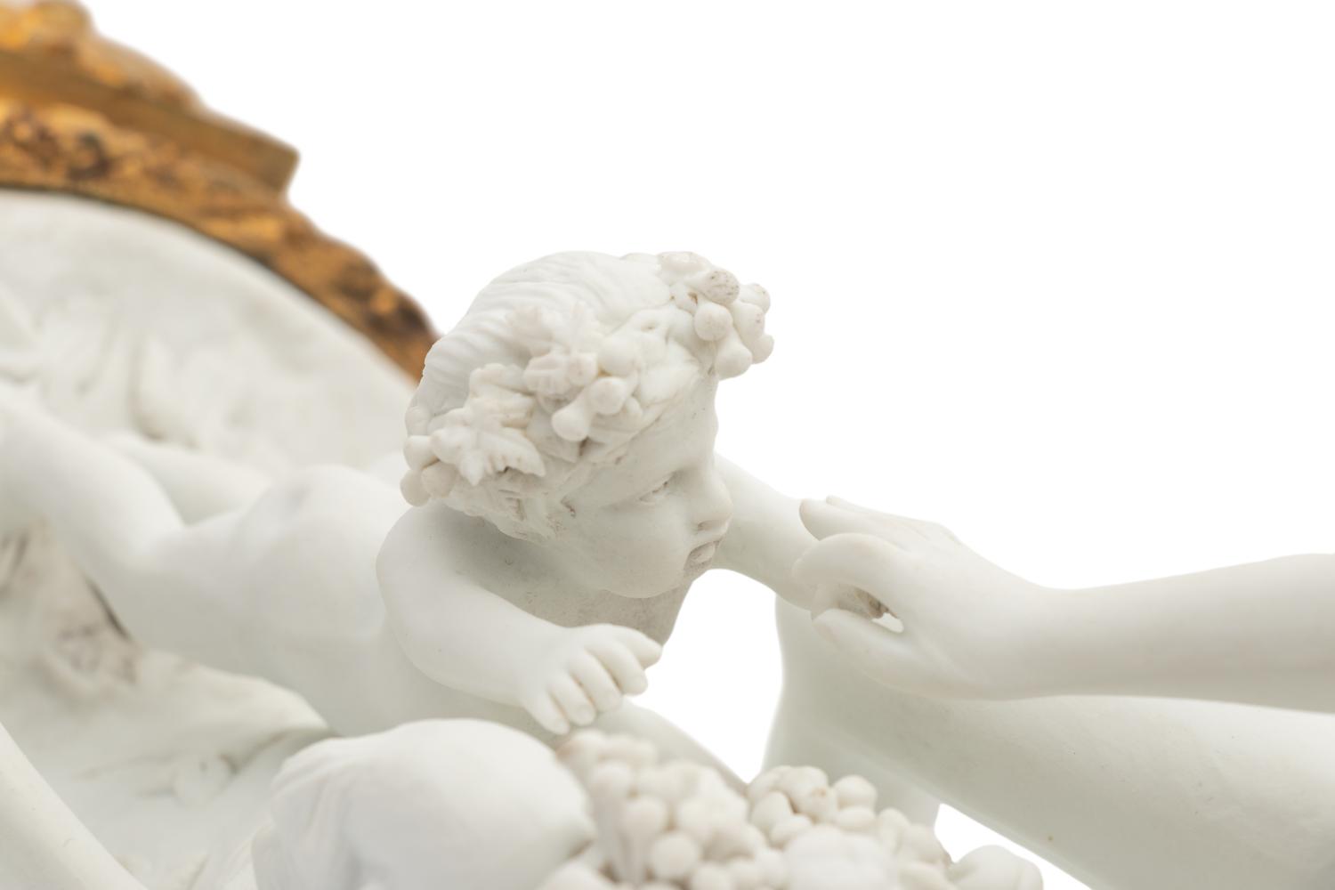 A French Gilt Bronze Mounted Biscuit Porcelain Group
