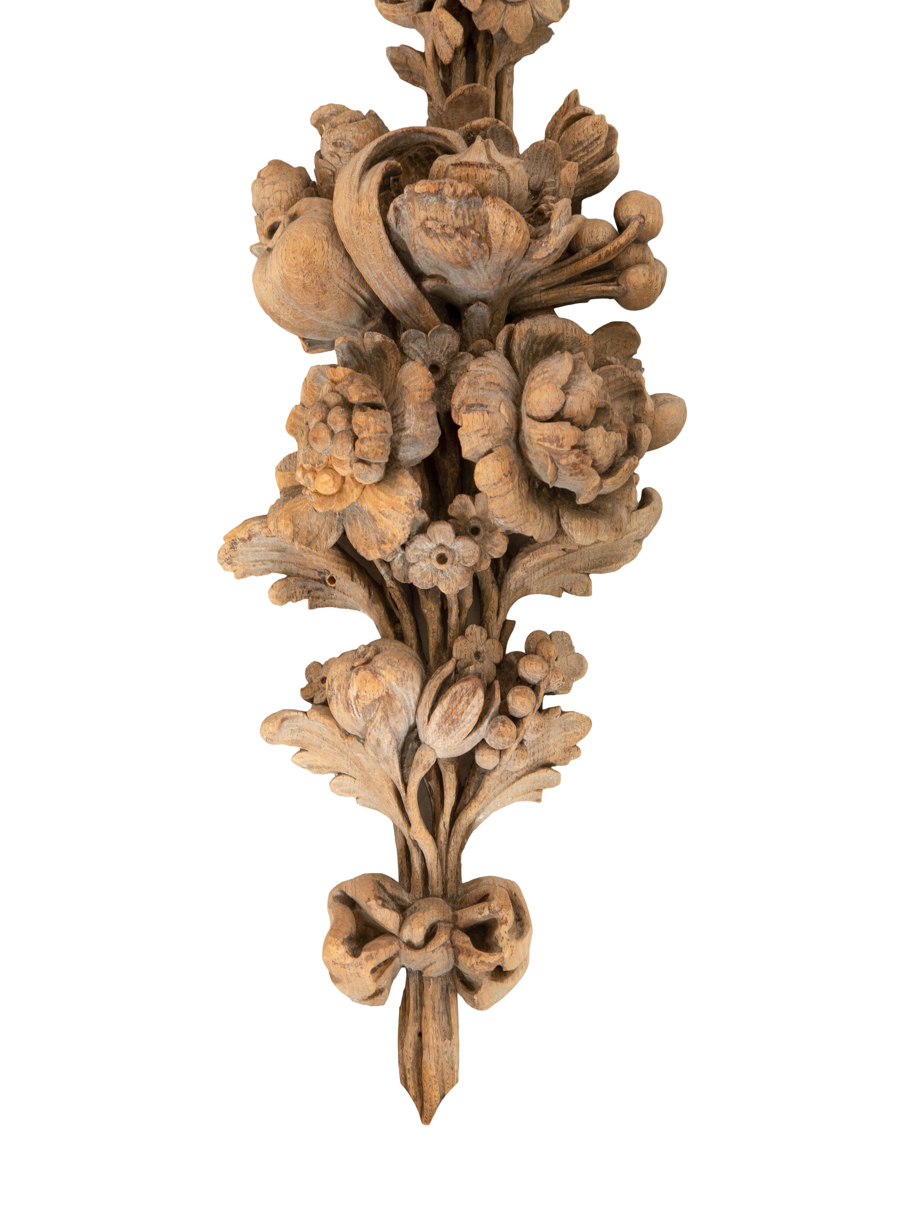 A Pair of Continental Carved Limed Oak Boiserie Swag Wall Appliques