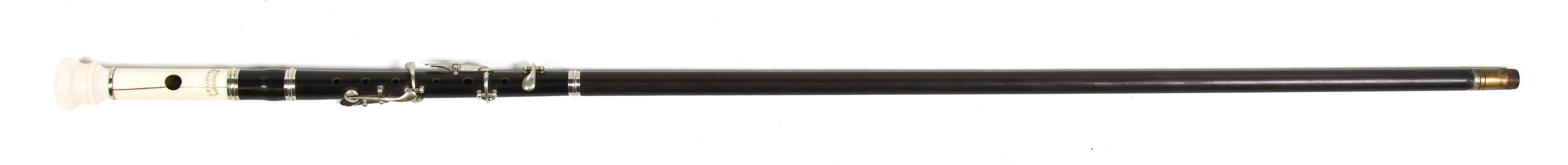 An Ebony and Ivory Flute Walking Stick, H.F. Meyer, Height overall 36 3/8 x length of flute 12 1/2 inches.