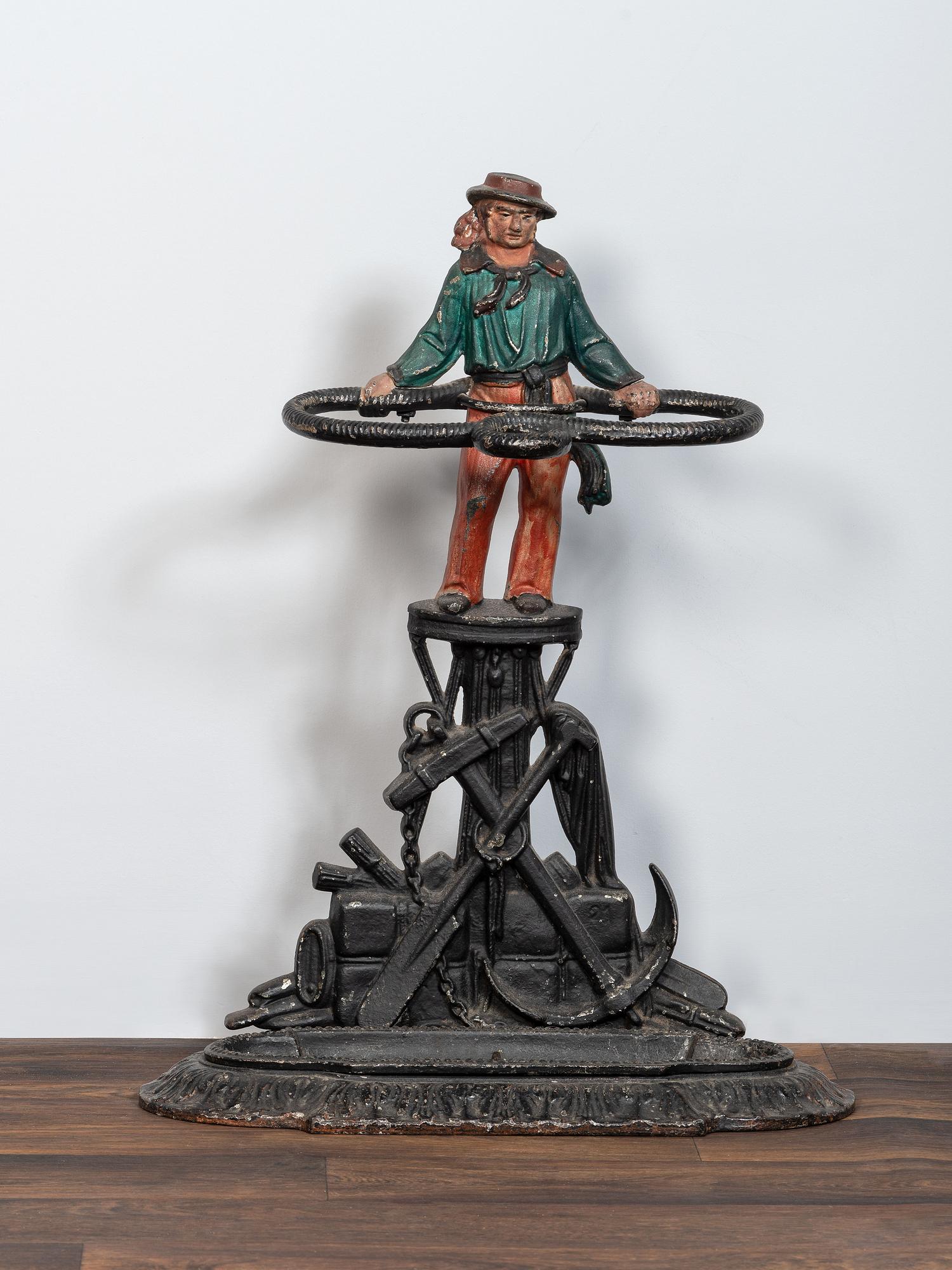 A Victorian Cold Painted Iron Umbrella Stand with Sailor Figure