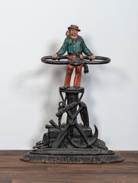 A Victorian Cold Painted Iron Umbrella Stand with Sailor Figure