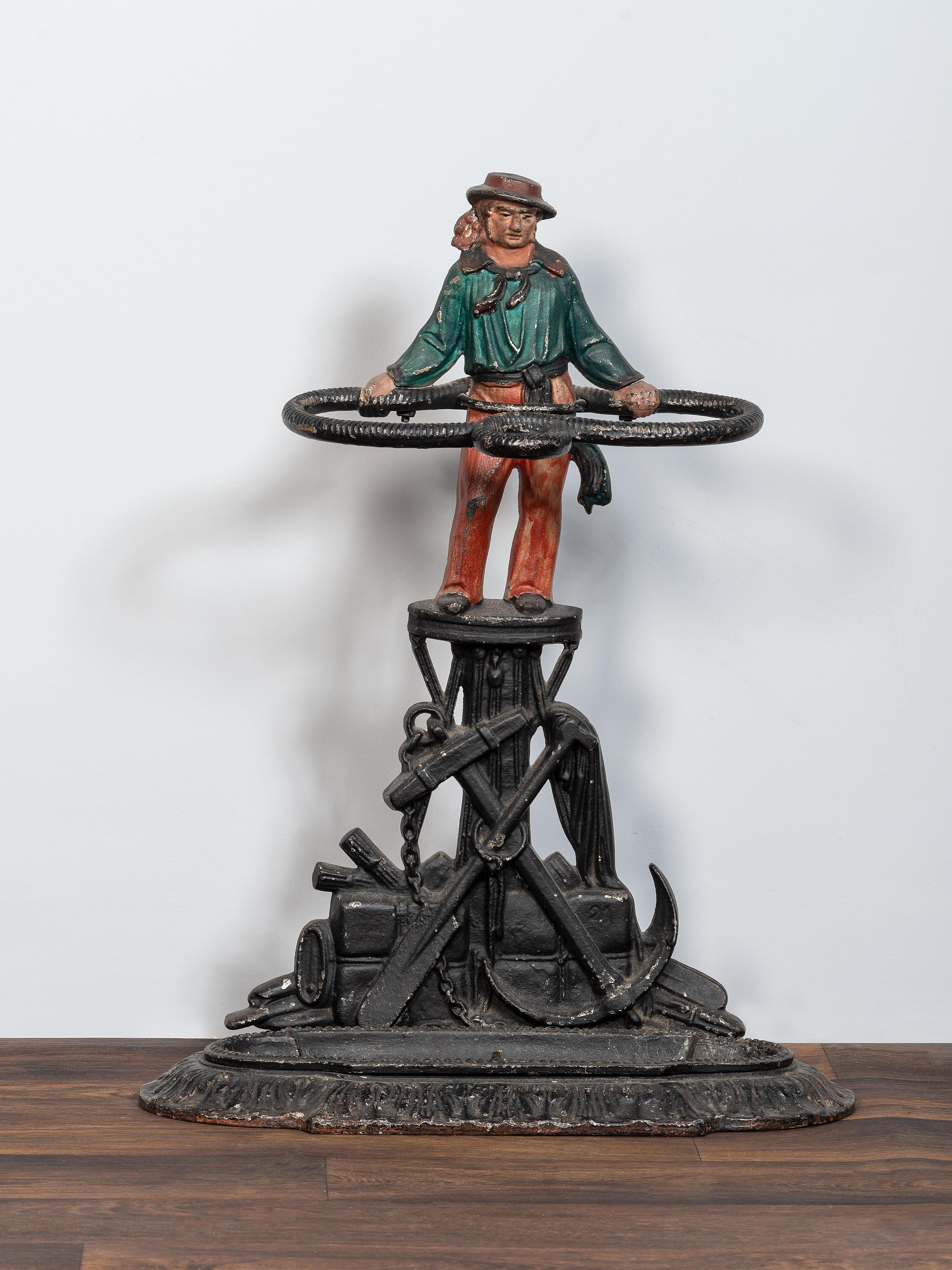 A Victorian Cold Painted Iron Umbrella Stand with Sailor Figure