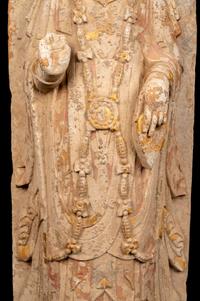 A Chinese Carved Stone Standing Buddha with Remnants of Gilt on Lotus-Form Base