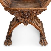 A Pair of Italian Carved Walnut Savonarola Chairs