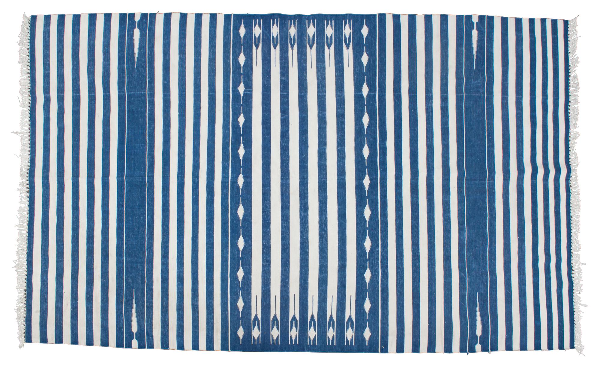 A Dhurrie Rug 8 feet 10 inches x 5 feet 7 inches. — 20TH CENTURY