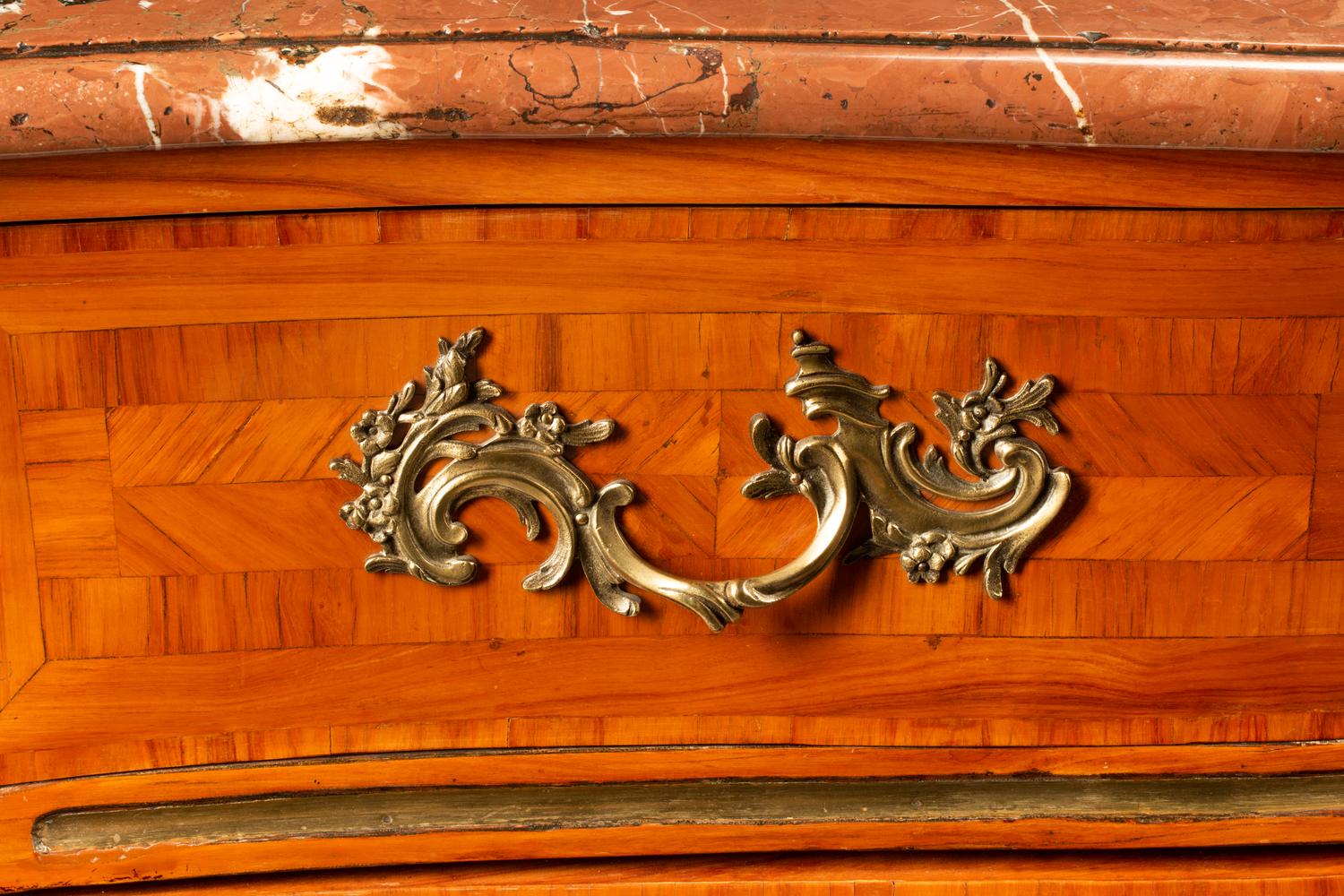 A Regence Style Gilt Bronze Mounted Parquetry Marble-Top Commode