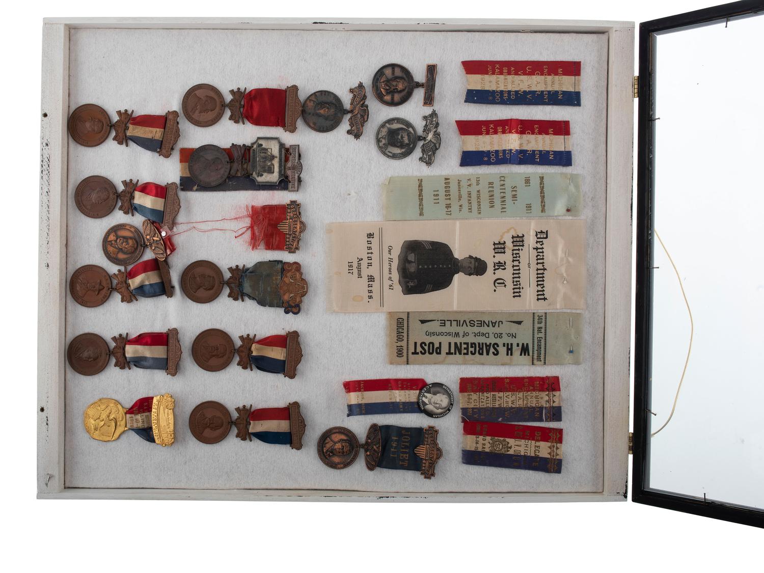 [CIVIL WAR -GRAND ARMY OF THE REPUBLIC & WOMEN'S RELIEF CORPS]. A large group of GAR, WRC, and other veterans' group ribbons and badges from Michigan, Wisconsin Indiana, and Illinois.