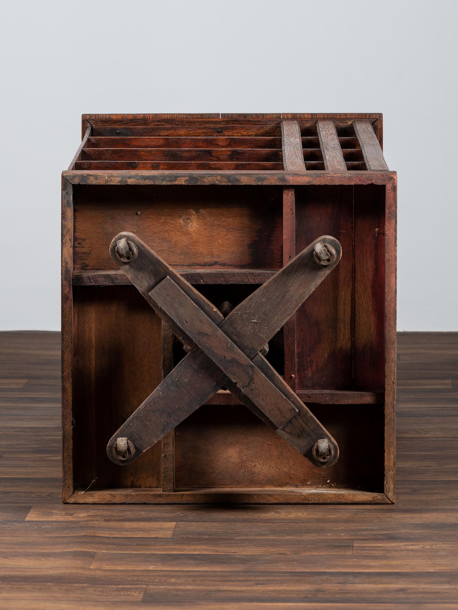A Country Store Iron-Mounted Oak Rotating Bookshelf