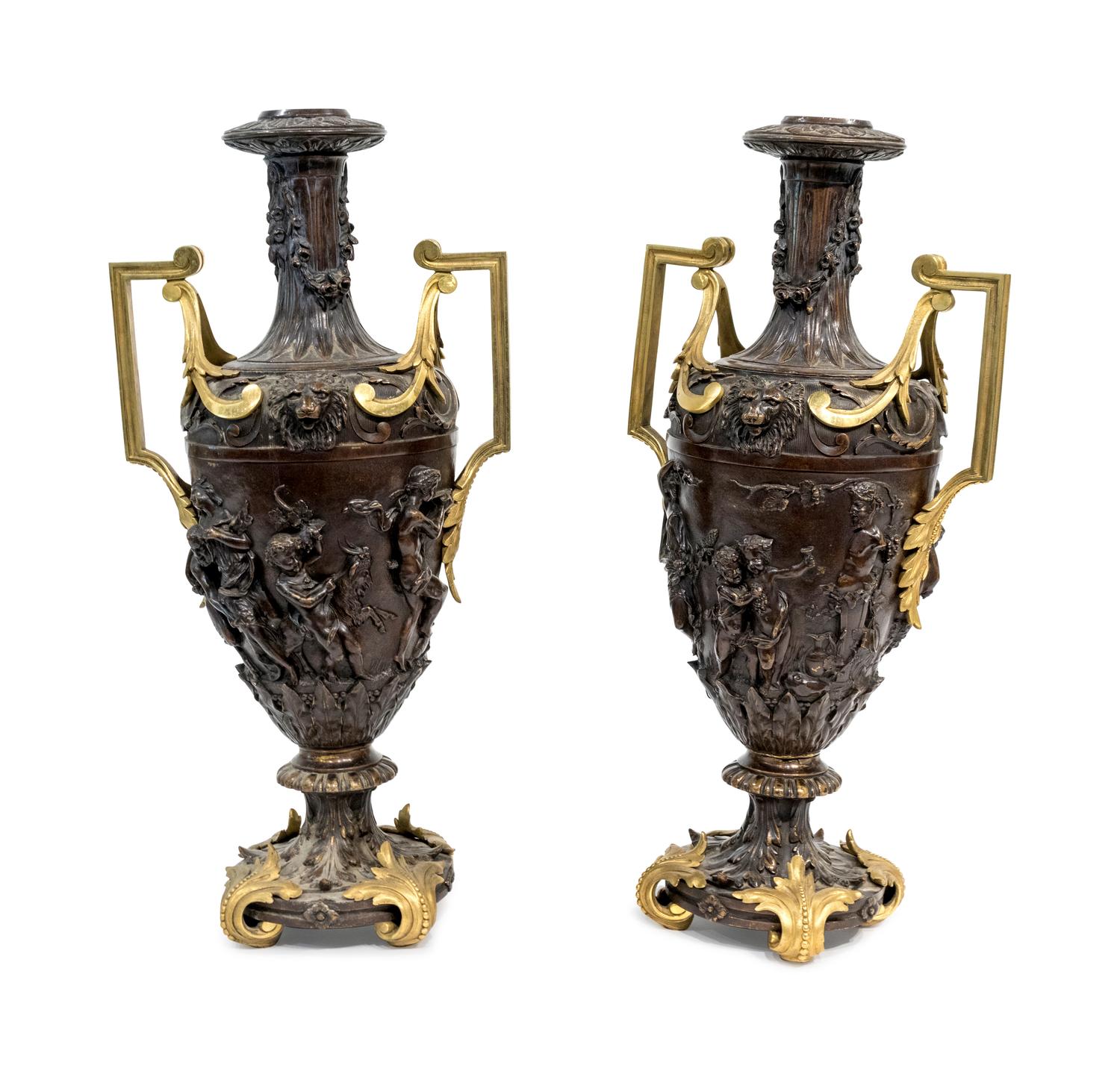 A Pair of Neoclassical Style Parcel-Gilt and Patinated Metal Two-Handled Urns