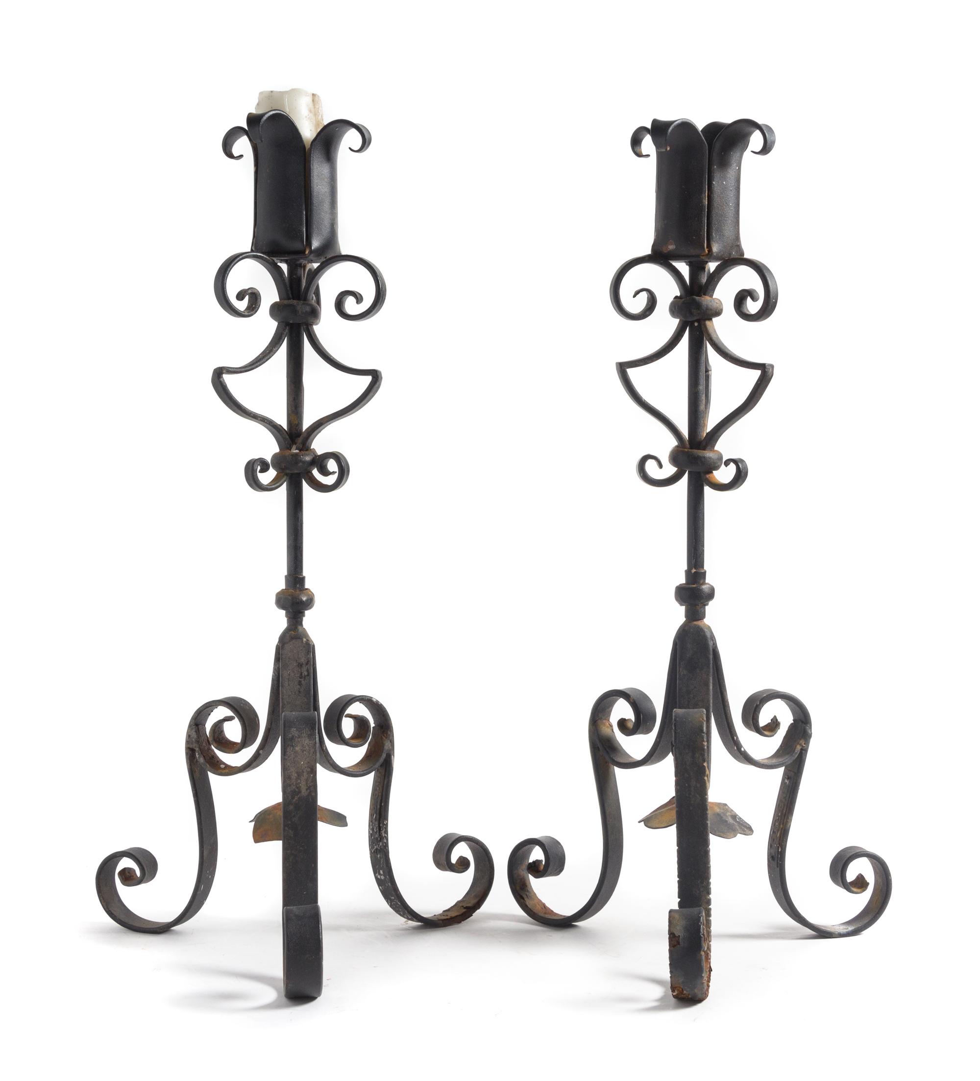A Pair of Wrought Iron Prickets Height 27 inches.