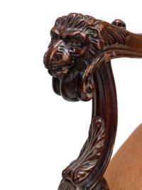 A Pair of William and Mary Style Carved Walnut Armchairs