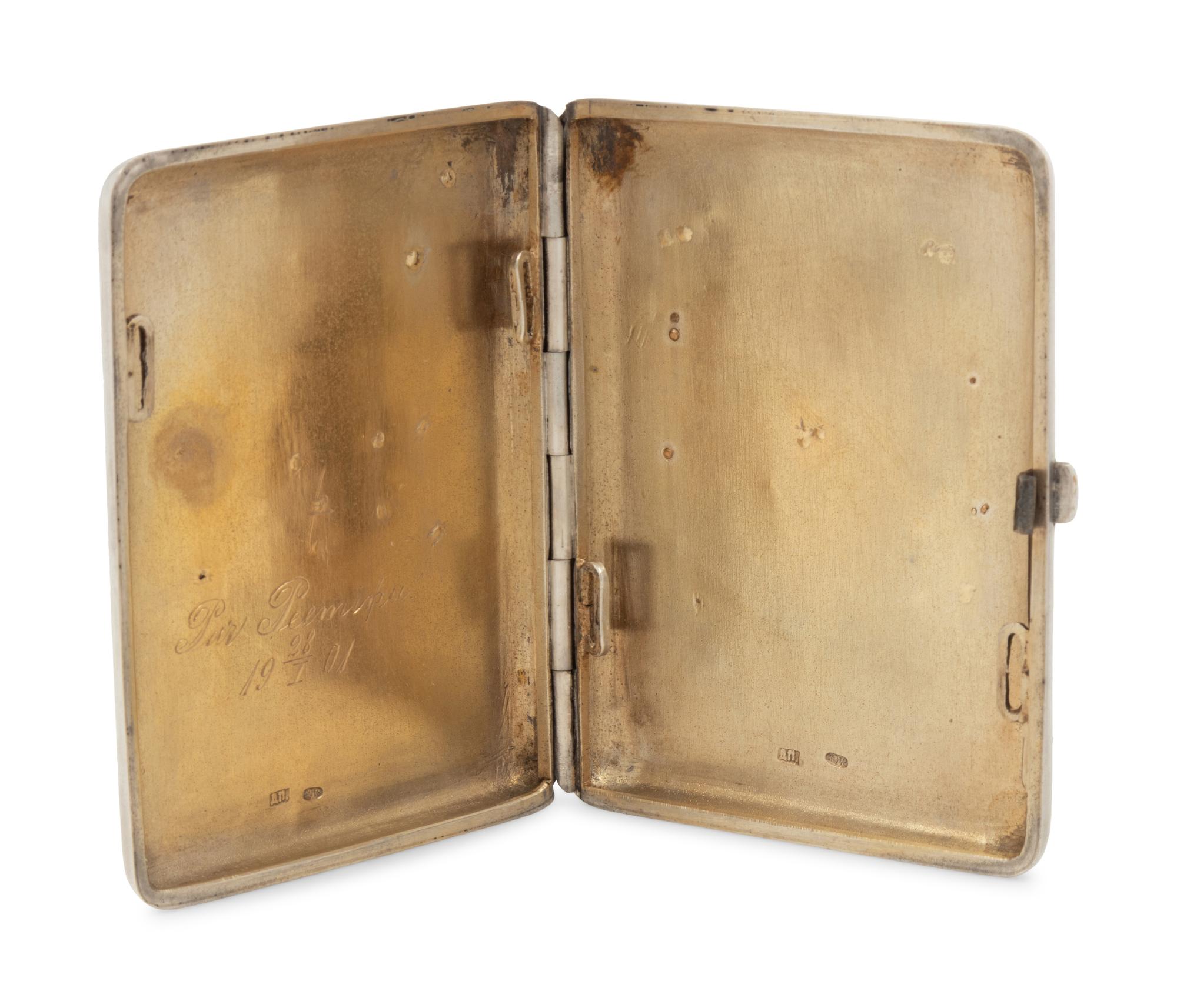 A Russian Gold, Silver and Enamel Charm Mounted Silver Cigarette Case