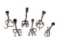 Six Branding Iron Candlesticks