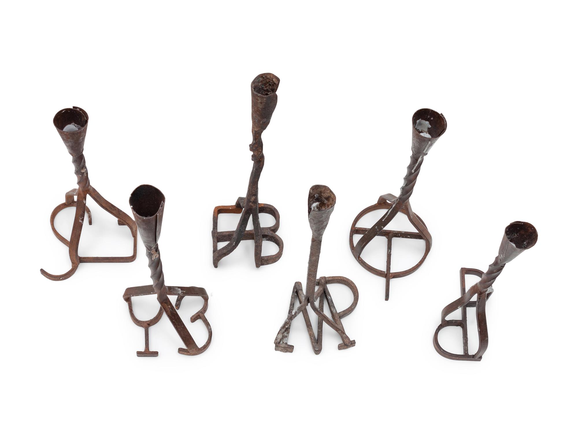 Six Branding Iron Candlesticks