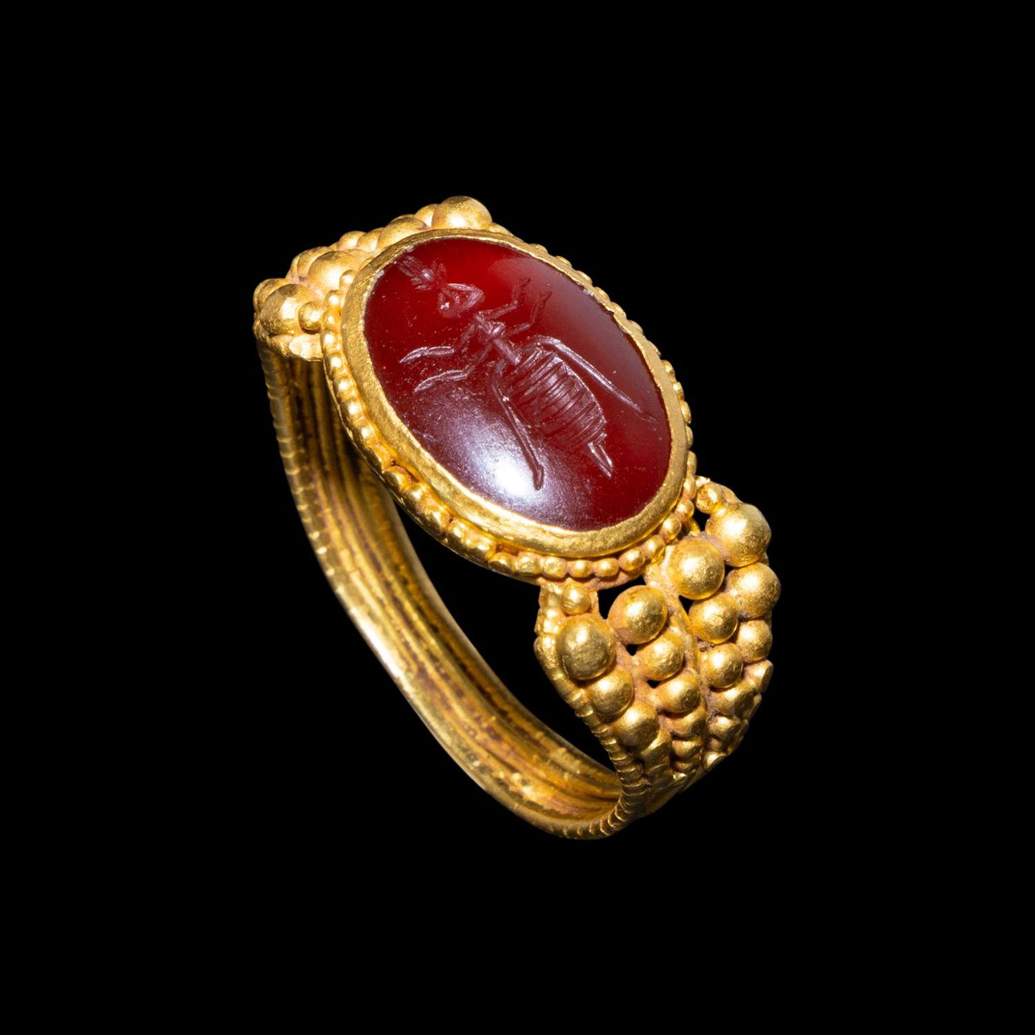 A Late Roman Gold and Carnelian Ring with an Ant Carrying an Ear of Wheat