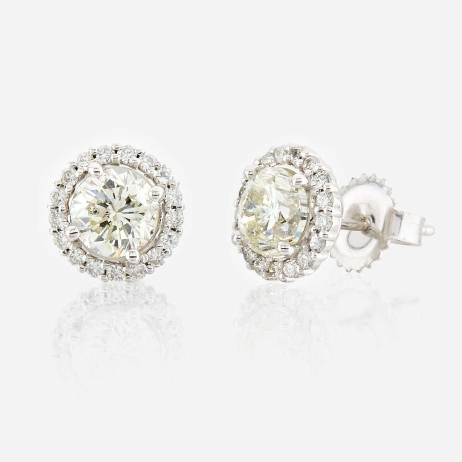 A pair of diamond and white gold earrings