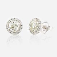 A pair of diamond and white gold earrings
