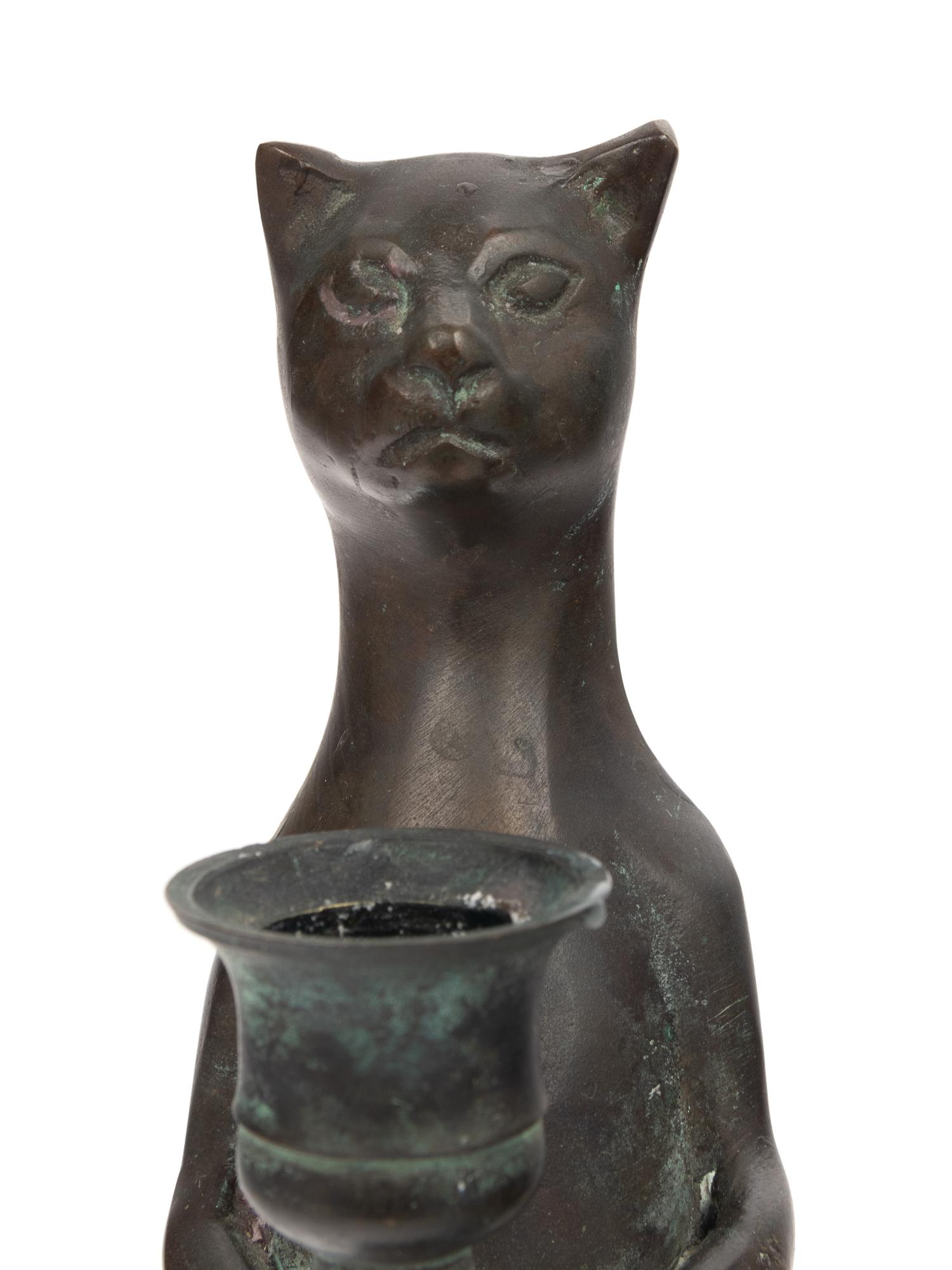 A Pair of Pewter Cat-Form Candlesticks