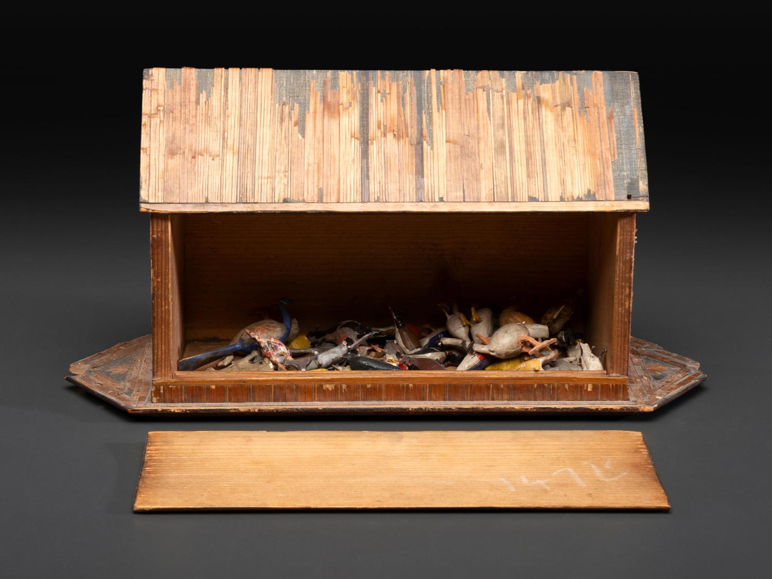 A Carved Wood and Applied Straw Work Noah's Ark with Slide-Front Cover
