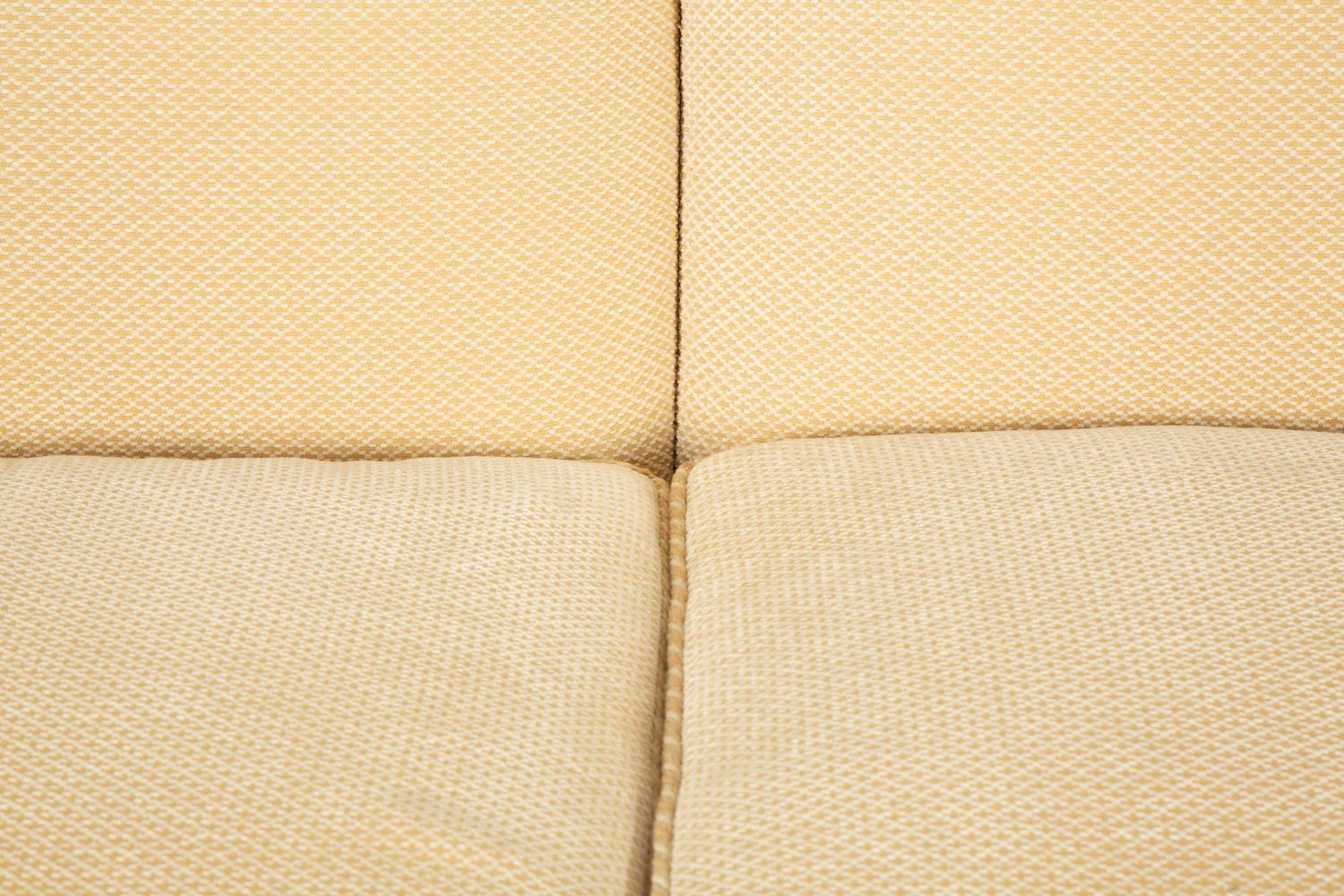 A Pair of Ivory Upholstered Three Cushion Sofas — 20th Century