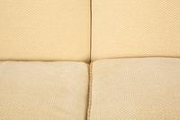 A Pair of Ivory Upholstered Three Cushion Sofas — 20th Century