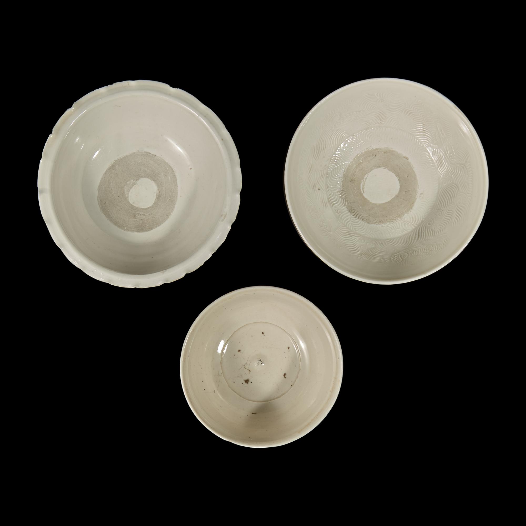 Two Chinese Huozhou White Glazed Bowls and a Stem Cup, Song Dynasty 宋 霍州窯白釉瓷碗二及高足杯一