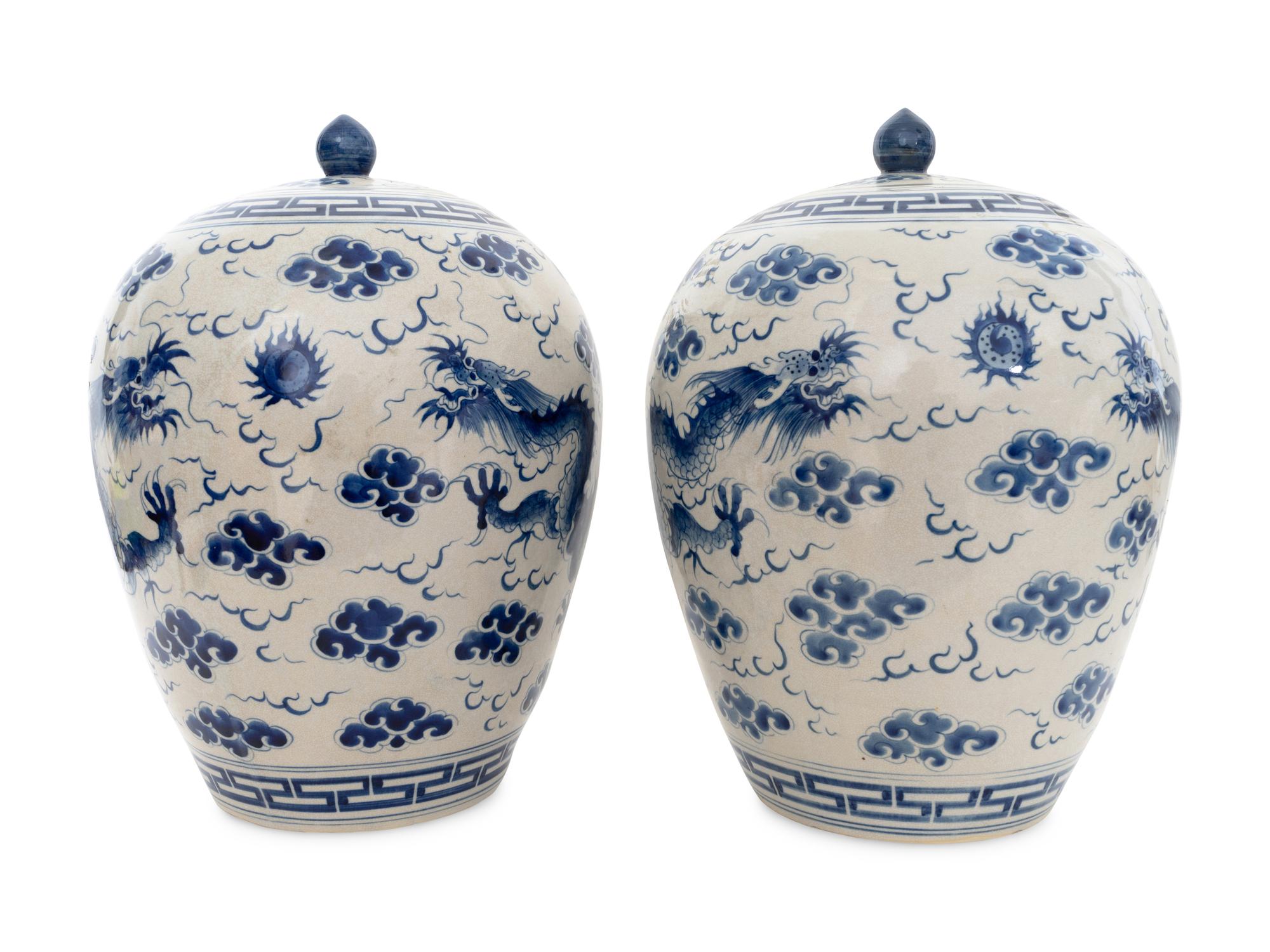 A Pair of Large Chinese Porcelain Blue and White Dragon Lidded Urns