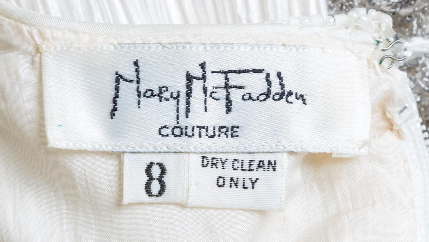 A Mary McFadden White Pleated Column Gown, Size 8.