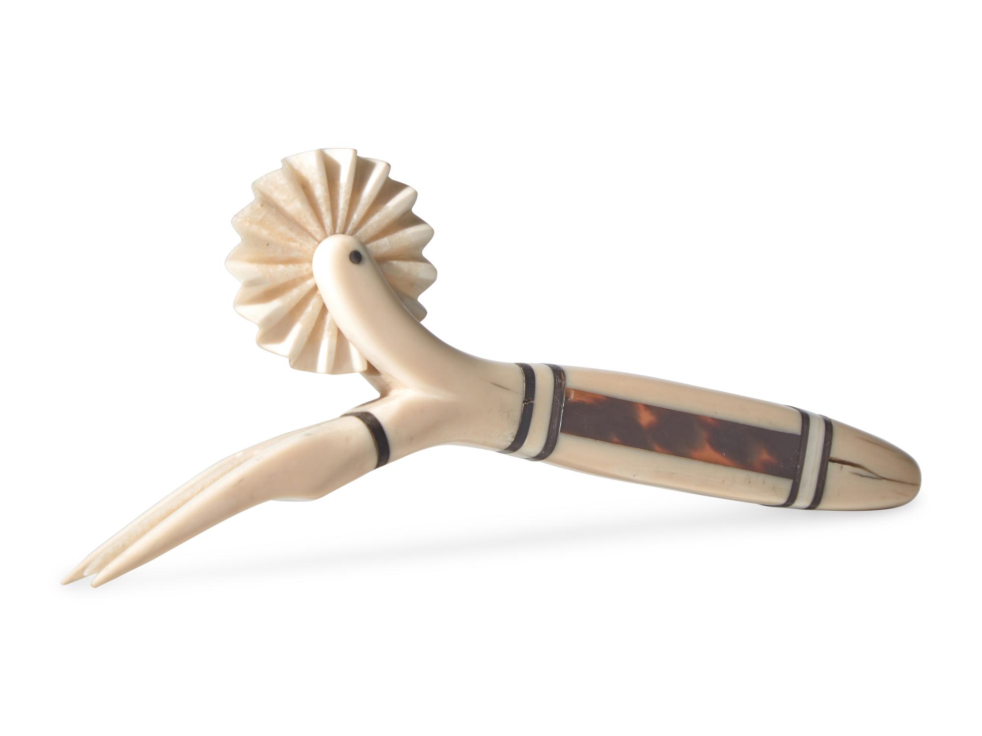 A Scrimshaw Carved Whale Tooth Pie Crimper and Fork, 19th Century