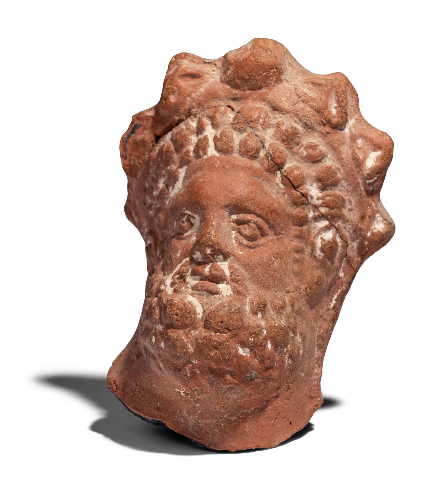 An Egyptian Terracotta Head of Serapis
